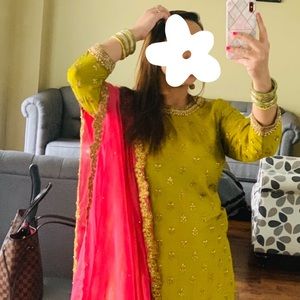 Green and pink/peach embroidered lehnga